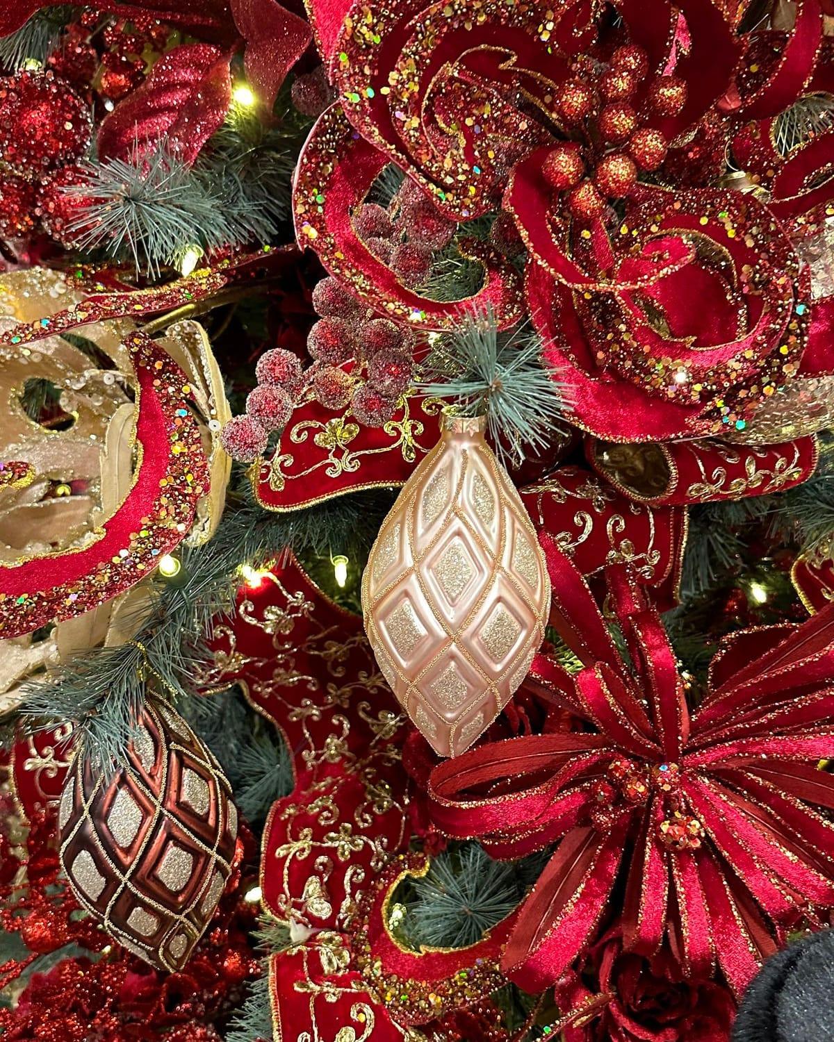 Regency Red palette: deep red velvet ribbon and blooms with gold-trimmed ornaments
